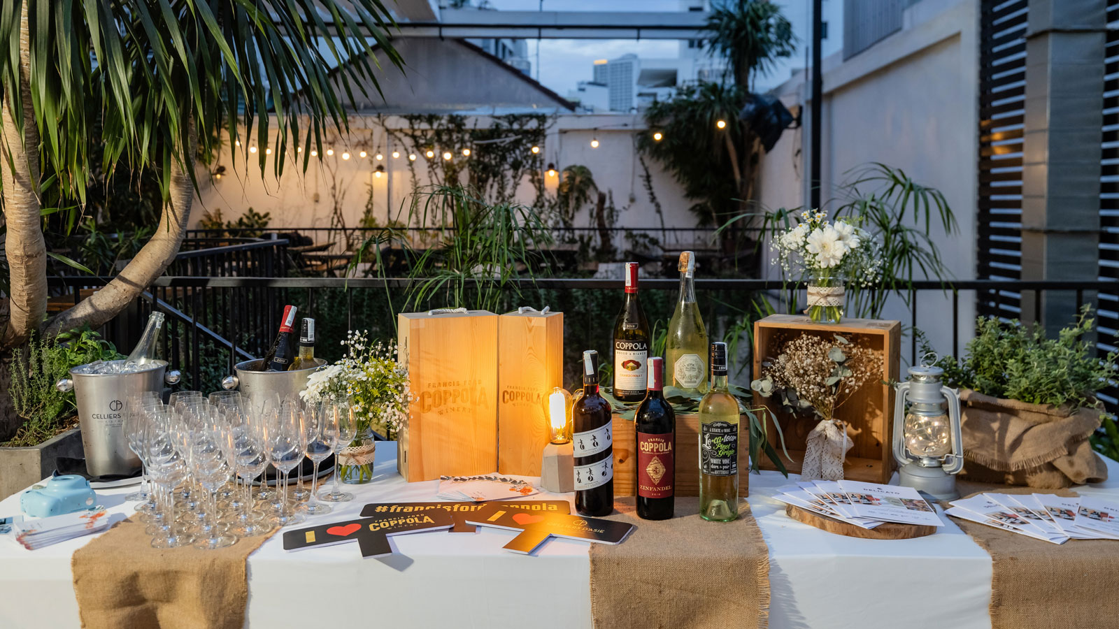 Decorative table with wine bottles and glasses